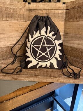 Supernatural Drawstring Backpack with anti-possession symbol.